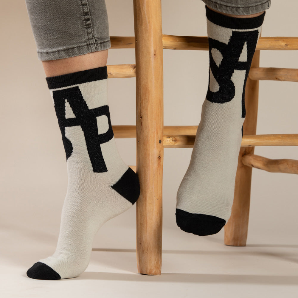 Elevate your everyday style with our elegant unisex socks designed by the KaRiniTi Studio. These monochromatic socks blend clean lines with subtle, refined details, echoing our passion for precision and typography. Perfect for any outfit, each pair brings a unique design element inspired by our studio's signature obsession with structured layouts and minimalist aesthetics.
ASAP: Make a statement with the ASAP socks, reflecting the dynamic energy of KaRiniTi's ASAP notebook. These socks are your fast track
