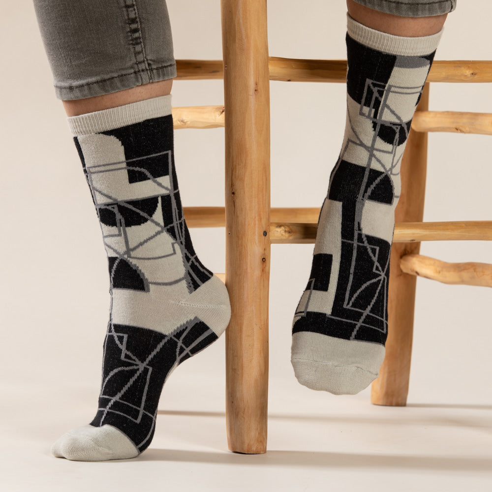 Elevate your everyday style with our elegant unisex socks designed by the KaRiniTi Studio. These monochromatic socks blend clean lines with subtle, refined details, echoing our passion for precision and typography. Perfect for any outfit, each pair brings a unique design element inspired by our studio's signature obsession with structured layouts and minimalist aesthetics.
Cutout: Inspired by our silkscreen prints, this design layers typography, numbers, and contour lines, forming a bold new composition. I