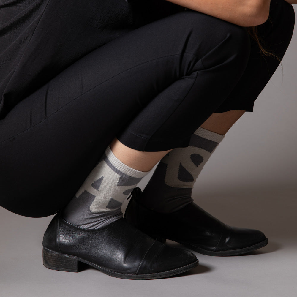 Elevate your everyday style with our elegant unisex socks designed by the KaRiniTi Studio. These monochromatic socks blend clean lines with subtle, refined details, echoing our passion for precision and typography. Perfect for any outfit, each pair brings a unique design element inspired by our studio's signature obsession with structured layouts and minimalist aesthetics.
ASAP: Make a statement with the ASAP socks, reflecting the dynamic energy of KaRiniTi's ASAP notebook. These socks are your fast track
