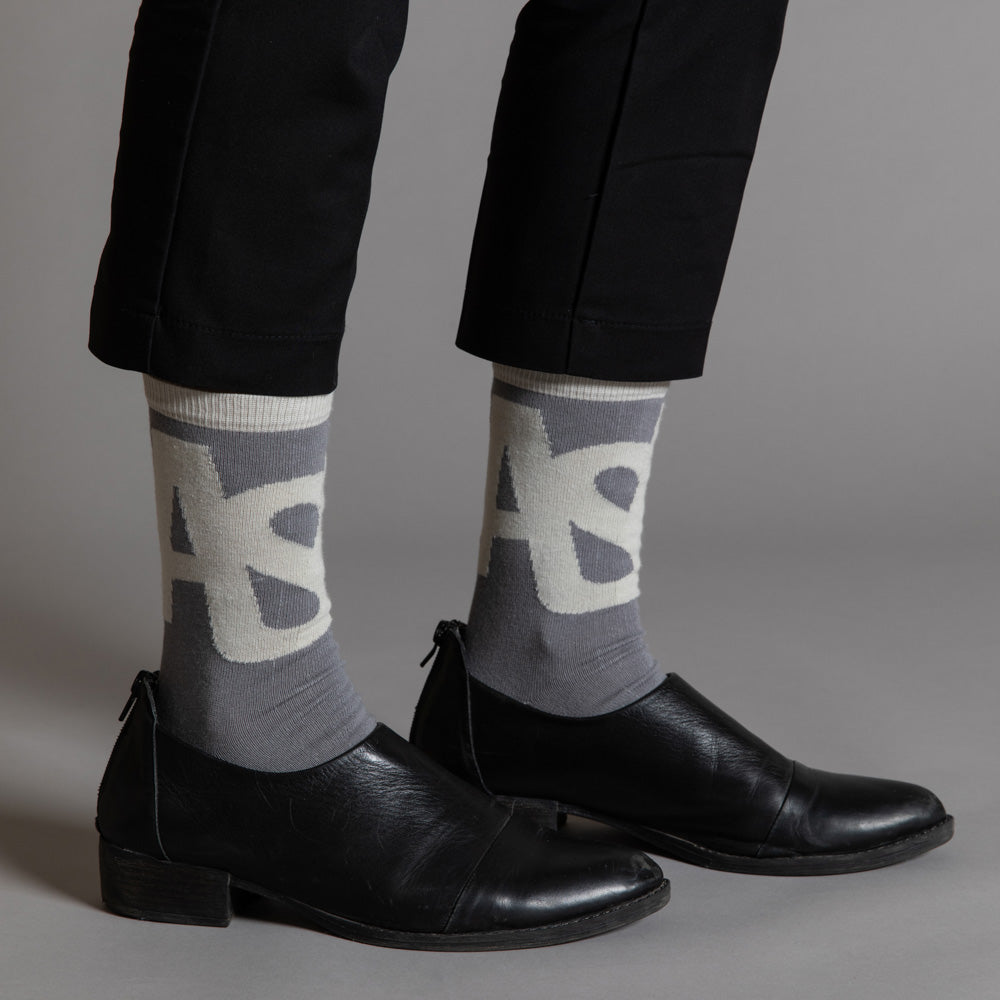 Elevate your everyday style with our elegant unisex socks designed by the KaRiniTi Studio. These monochromatic socks blend clean lines with subtle, refined details, echoing our passion for precision and typography. Perfect for any outfit, each pair brings a unique design element inspired by our studio's signature obsession with structured layouts and minimalist aesthetics.
ASAP: Make a statement with the ASAP socks, reflecting the dynamic energy of KaRiniTi's ASAP notebook. These socks are your fast track