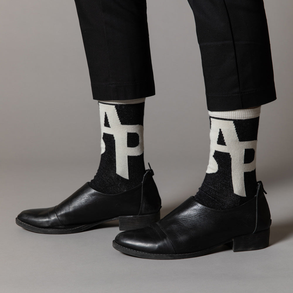 Elevate your everyday style with our elegant unisex socks designed by the KaRiniTi Studio. These monochromatic socks blend clean lines with subtle, refined details, echoing our passion for precision and typography. Perfect for any outfit, each pair brings a unique design element inspired by our studio's signature obsession with structured layouts and minimalist aesthetics.
ASAP: Make a statement with the ASAP socks, reflecting the dynamic energy of KaRiniTi's ASAP notebook. These socks are your fast track
