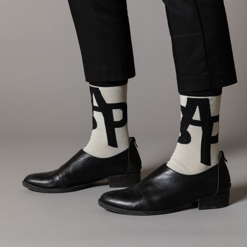 Elevate your everyday style with our elegant unisex socks designed by the KaRiniTi Studio. These monochromatic socks blend clean lines with subtle, refined details, echoing our passion for precision and typography. Perfect for any outfit, each pair brings a unique design element inspired by our studio's signature obsession with structured layouts and minimalist aesthetics.
ASAP: Make a statement with the ASAP socks, reflecting the dynamic energy of KaRiniTi's ASAP notebook. These socks are your fast track