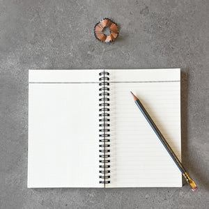 KaRiniTi - A two-way spiral notebook, so you can write from right to left or left to right.  Hardcover in Gray/Black  A Semicolon icon (;) on one side of the cover,  and a colon icon (:) on the other side of the cover.   ▲ Size 13 cm -19 cm  ▲ 80 pages | 40 cream lined paper | 40 cream dotted grid paper   