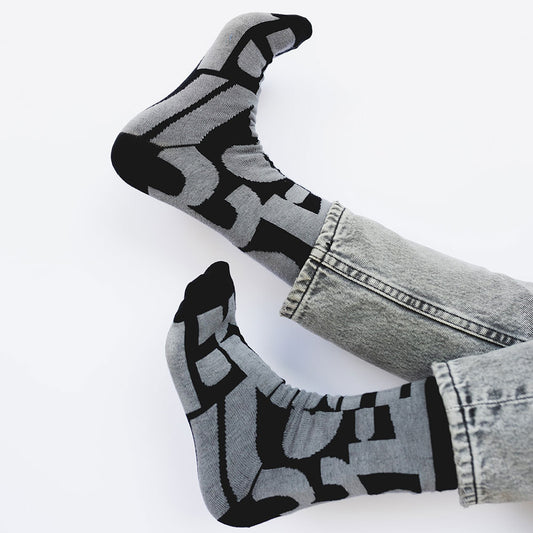 Elevate your everyday style with our elegant unisex socks designed by the KaRiniTi Studio. These monochromatic socks blend clean lines with subtle, refined details, echoing our passion for precision and typography. Perfect for any outfit, each pair brings a unique design element inspired by our studio's signature obsession with structured layouts and minimalist aesthetics.
- Numbers: Featuring bold, oversized numbers in various cuts, this design draws inspiration from KaRiniTi's signature wrapping paper. T