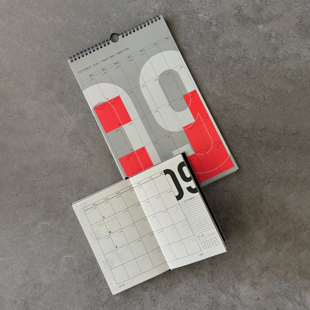 KaRiniTi Wall Calendar 2026-2027 open to September monthly spread with red holiday highlights, and Weekly Calendar September view below