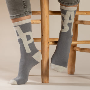 Elevate your everyday style with our elegant unisex socks designed by the KaRiniTi Studio. These monochromatic socks blend clean lines with subtle, refined details, echoing our passion for precision and typography. Perfect for any outfit, each pair brings a unique design element inspired by our studio's signature obsession with structured layouts and minimalist aesthetics.

ASAP: Make a statement with the ASAP socks, reflecting the dynamic energy of KaRiniTi's ASAP notebook. These socks are your fast track 