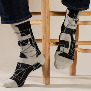 Elevate your everyday style with our elegant unisex socks designed by the KaRiniTi Studio. These monochromatic socks blend clean lines with subtle, refined details, echoing our passion for precision and typography. Perfect for any outfit, each pair brings a unique design element inspired by our studio's signature obsession with structured layouts and minimalist aesthetics.

Cutout: Inspired by our silkscreen prints, this design layers typography, numbers, and contour lines, forming a bold new composition. I