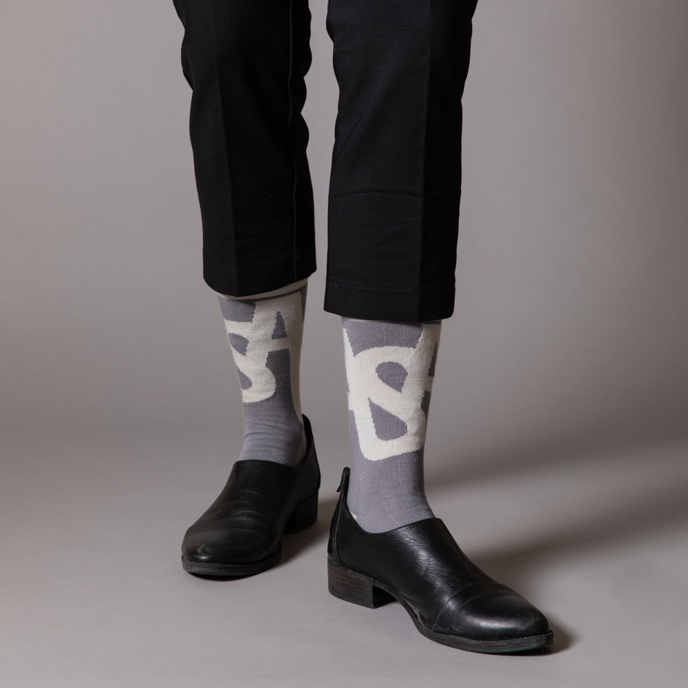 Elevate your everyday style with our elegant unisex socks designed by the KaRiniTi Studio. These monochromatic socks blend clean lines with subtle, refined details, echoing our passion for precision and typography. Perfect for any outfit, each pair brings a unique design element inspired by our studio's signature obsession with structured layouts and minimalist aesthetics.

ASAP: Make a statement with the ASAP socks, reflecting the dynamic energy of KaRiniTi's ASAP notebook. These socks are your fast track 