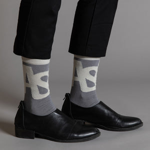 Elevate your everyday style with our elegant unisex socks designed by the KaRiniTi Studio. These monochromatic socks blend clean lines with subtle, refined details, echoing our passion for precision and typography. Perfect for any outfit, each pair brings a unique design element inspired by our studio's signature obsession with structured layouts and minimalist aesthetics.

ASAP: Make a statement with the ASAP socks, reflecting the dynamic energy of KaRiniTi's ASAP notebook. These socks are your fast track 