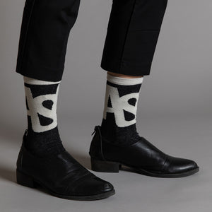 Elevate your everyday style with our elegant unisex socks designed by the KaRiniTi Studio. These monochromatic socks blend clean lines with subtle, refined details, echoing our passion for precision and typography. Perfect for any outfit, each pair brings a unique design element inspired by our studio's signature obsession with structured layouts and minimalist aesthetics.

ASAP: Make a statement with the ASAP socks, reflecting the dynamic energy of KaRiniTi's ASAP notebook. These socks are your fast track 