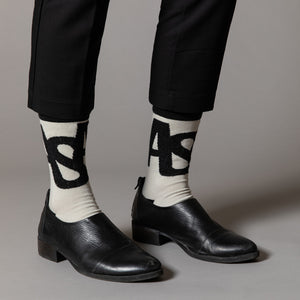 Elevate your everyday style with our elegant unisex socks designed by the KaRiniTi Studio. These monochromatic socks blend clean lines with subtle, refined details, echoing our passion for precision and typography. Perfect for any outfit, each pair brings a unique design element inspired by our studio's signature obsession with structured layouts and minimalist aesthetics.

ASAP: Make a statement with the ASAP socks, reflecting the dynamic energy of KaRiniTi's ASAP notebook. These socks are your fast track 