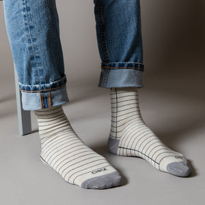 Elevate your everyday style with our elegant unisex socks designed by the KaRiniTi Studio. These monochromatic socks blend clean lines with subtle, refined details, echoing our passion for precision and typography. Perfect for any outfit, each pair brings a unique design element inspired by our studio's signature obsession with structured layouts and minimalist aesthetics.

Check: Inspired by our iconic To-Do list, this design reminds you to keep things moving. Sometimes, all it takes is a little checkmark 