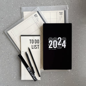 The Deluxe - 2023-2024 Calendar - Combo  In this combo you'll find:  > Weekly Calendar - Black / Gray cover / Daily Calendar  > 07 Days Planner - Weekly Organizer  > 31 Days Planner - Monthly Organizer  > To Do List - Paper Block  > Black Ruler  > Black Pencil  > Hexagon 0.35 Black Gel Pan - Black   > 2 Black Clip