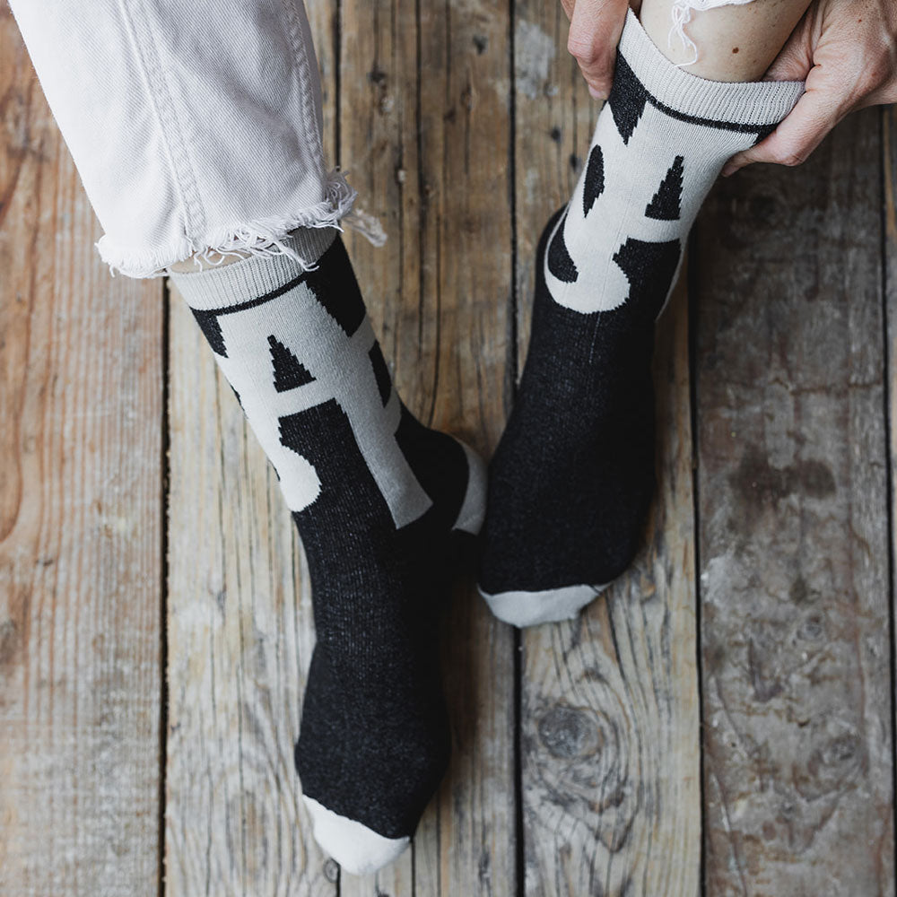 Elevate your everyday style with our elegant unisex socks designed by the KaRiniTi Studio. These monochromatic socks blend clean lines with subtle, refined details, echoing our passion for precision and typography. Perfect for any outfit, each pair brings a unique design element inspired by our studio's signature obsession with structured layouts and minimalist aesthetics.

ASAP: Make a statement with the ASAP socks, reflecting the dynamic energy of KaRiniTi's ASAP notebook. These socks are your fast track 