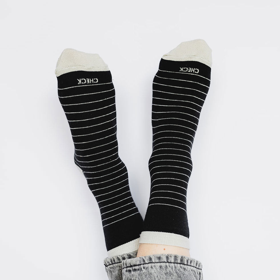 Elevate your everyday style with our elegant unisex socks designed by the KaRiniTi Studio. These monochromatic socks blend clean lines with subtle, refined details, echoing our passion for precision and typography. Perfect for any outfit, each pair brings a unique design element inspired by our studio's signature obsession with structured layouts and minimalist aesthetics.

Check: Inspired by our iconic To-Do list, this design reminds you to keep things moving. Sometimes, all it takes is a little checkmark 