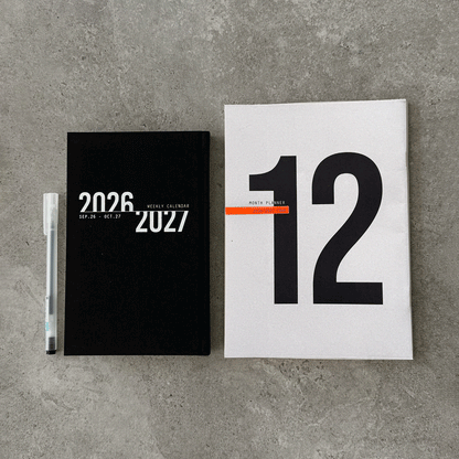 KaRiniTi Year Plan 2026/2027 – black weekly calendar and white 12-month planner covers with white gel pen