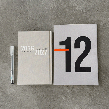 KaRiniTi Year Plan 2026/2027 – grey linen weekly calendar and grey 12-month planner with white gel pen