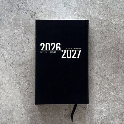 KaRiniTi Weekly Calendar 2026/2027 – black hardcover, Sep 26 – Oct 27