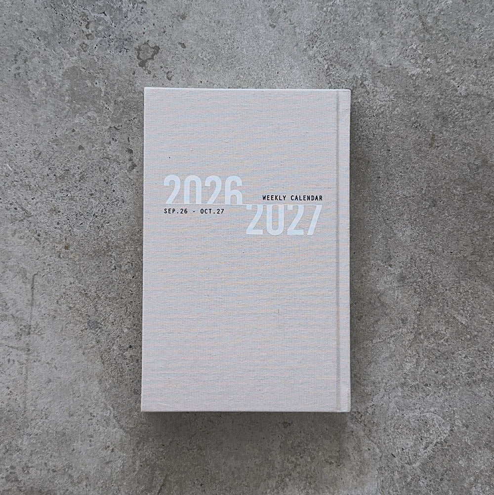 KaRiniTi Weekly Calendar 2026/2027 – grey linen cover front, Sep 26 – Oct 27
