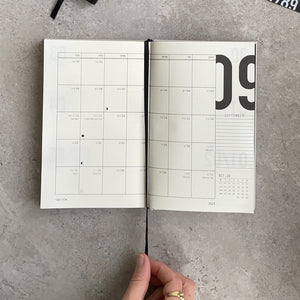 KaRiniTi - 2023-2024 hardcover Weekly calendar   Black fabric cover Gold foil / Gray fabric cover Black foil  Hebrew calendar Weekly + monthly spreads + extra ruled pages for lists International and Hebrew holidays Moon phases   > 27.08.23>>>05.10.24  > 144 pages  > 100 gr cream paper  > 13 cm X 20 cm  > Inner pocket  > Bookmark   Get organized  Can be combined with other products as a gift set
