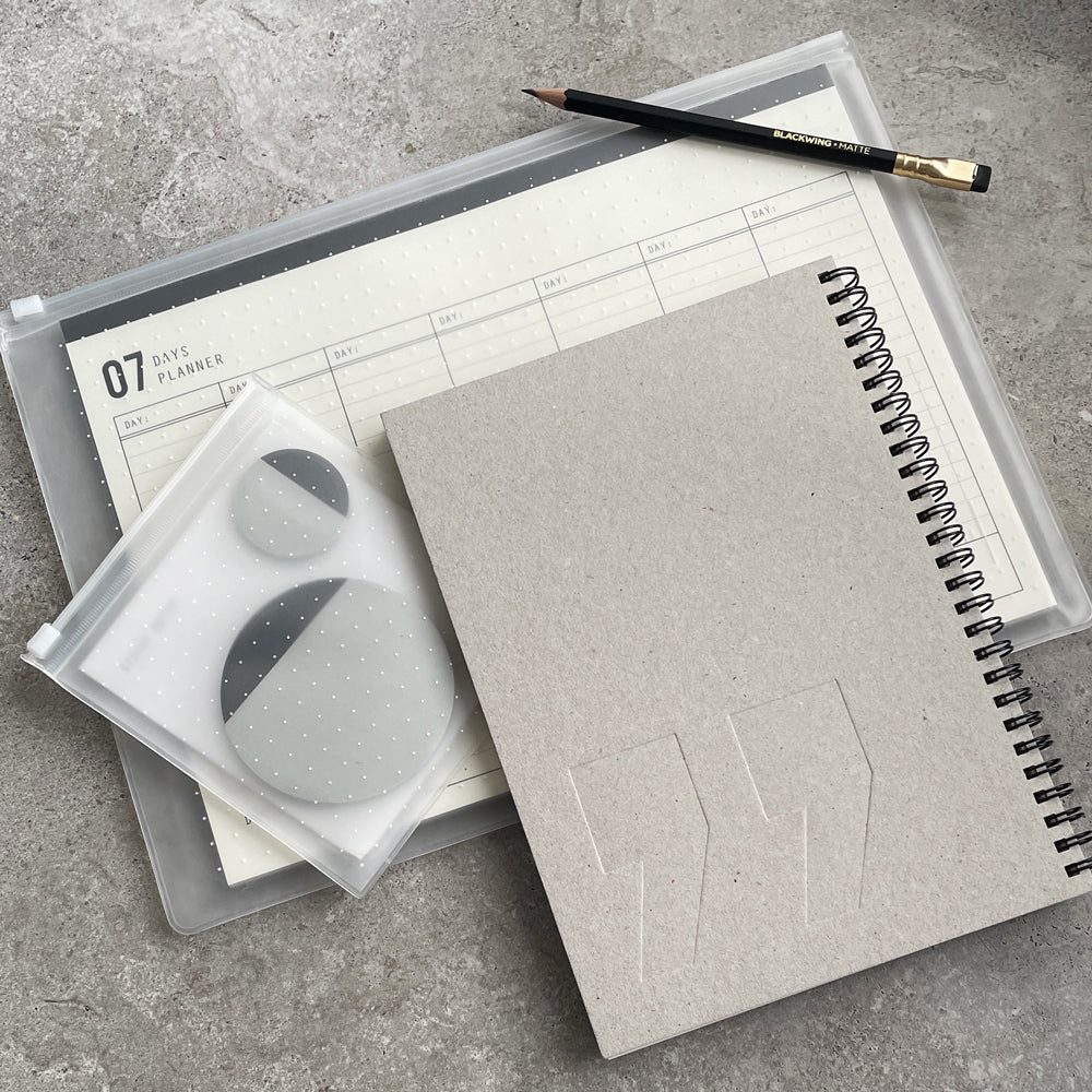 KaRiniTi - The Sticky Quote Combo  In this combo you'll find:  ▲ Spiral Notebook - Quote - Black / Gray  ▲ 07 Days Weekly Planner / 31 Days Monthly Planner  ▲ Sticky Note  ▲ Blackwing Pencil - Matte