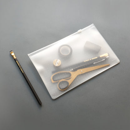 Transparent printed Zip Case- the magic pouch.  Perfect for storing and organizing all those items that always seem to find their way to the bottom of your bag!  Pens and pencils, makeup, jewelry, credit cards anything else you might need a stylish case for.  Made from Transparent EVA material (eco-friendly) with a plastic zipper.   Size medium: 18 cm - 27 cm / 7’’ - 10.5’’   *Items photographed with the Zip Case are not included.  